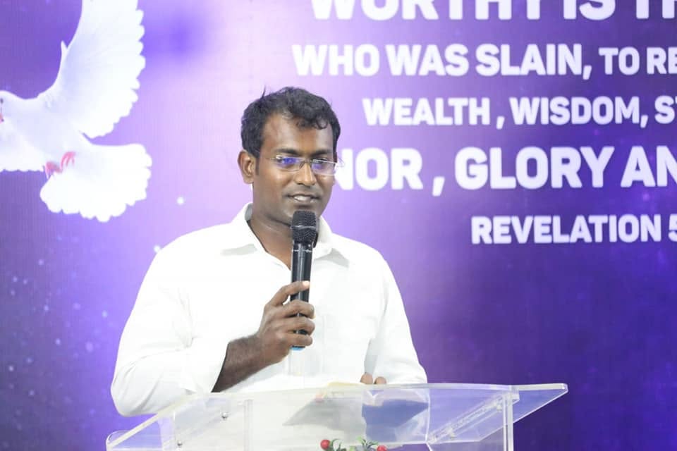 Pastor sharing a message at Agape Family Centre