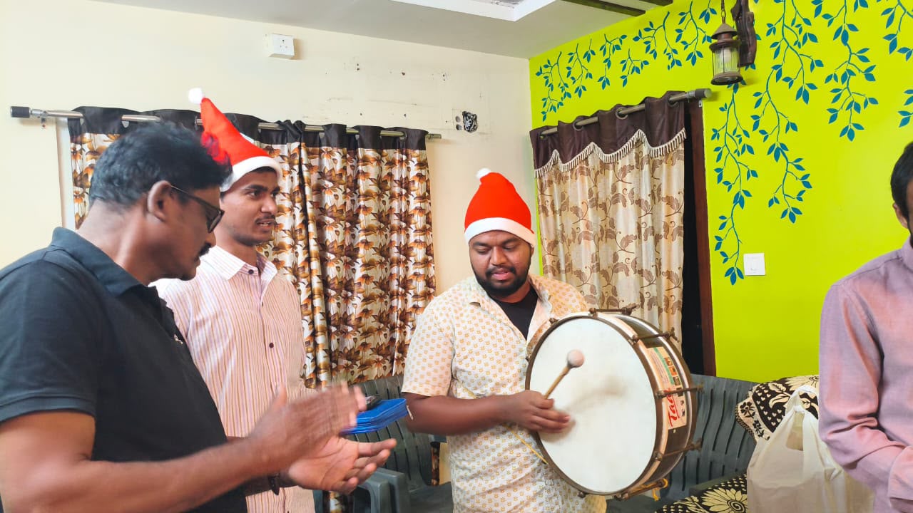 Christmas Carols 2025 — singing with a drum during a home visit